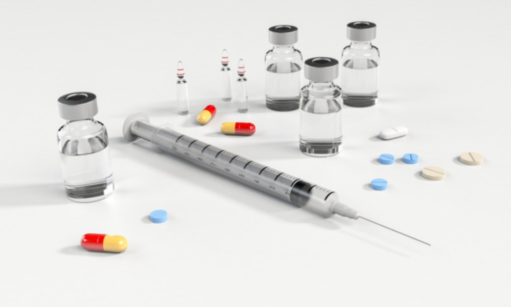 substanace abuse image with syringe and pills